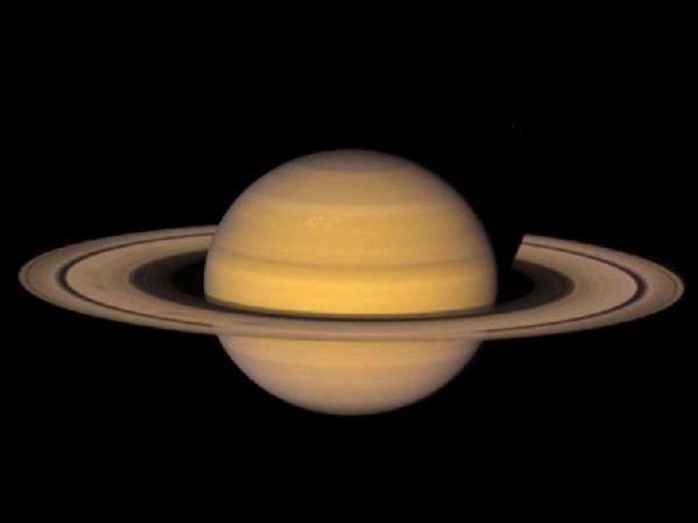 Saturn *Saturn is the sixth planet from the sun *It is 9.54 AU from the sun *It orbits the sun in 29.5 years *It takes 11 hours for Saturn to spin on its axis *It weighs 95 times that of the Earth *It is 9.42 times wider than the Earth *It has a gaseous surface. * Saturn's interior is hot (12000 K at the core) *It is named after Zeus' father, the god of agriculture *Saturn has 18 named moons *It has the best developed ring system in the Solar sytem *The rings were discovered by Gallileo using an early telescope *The rings are very thin - ony 1.5km wide