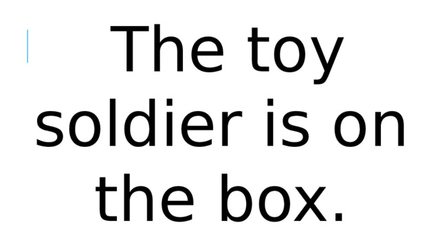 The toy soldier is on the box.