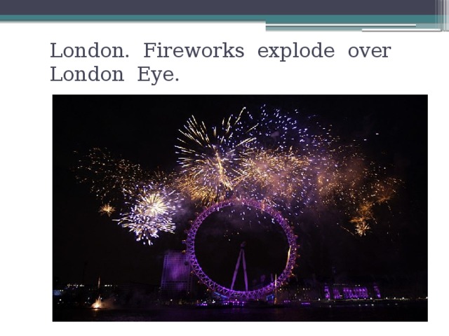 London. Fireworks explode over London Eye.