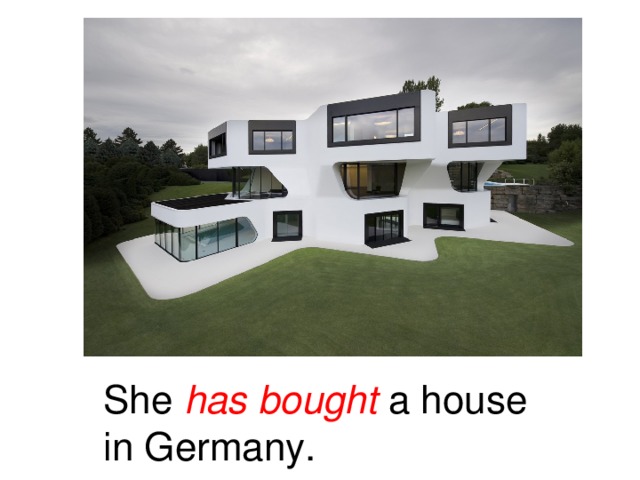 She has bought a house in Germany.