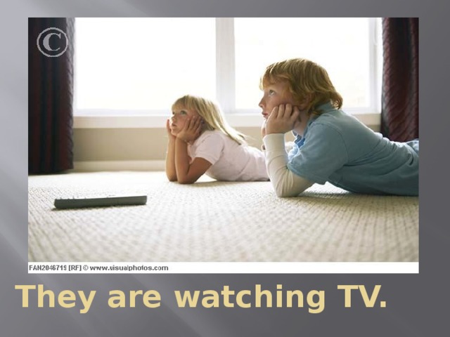 They are watching TV.